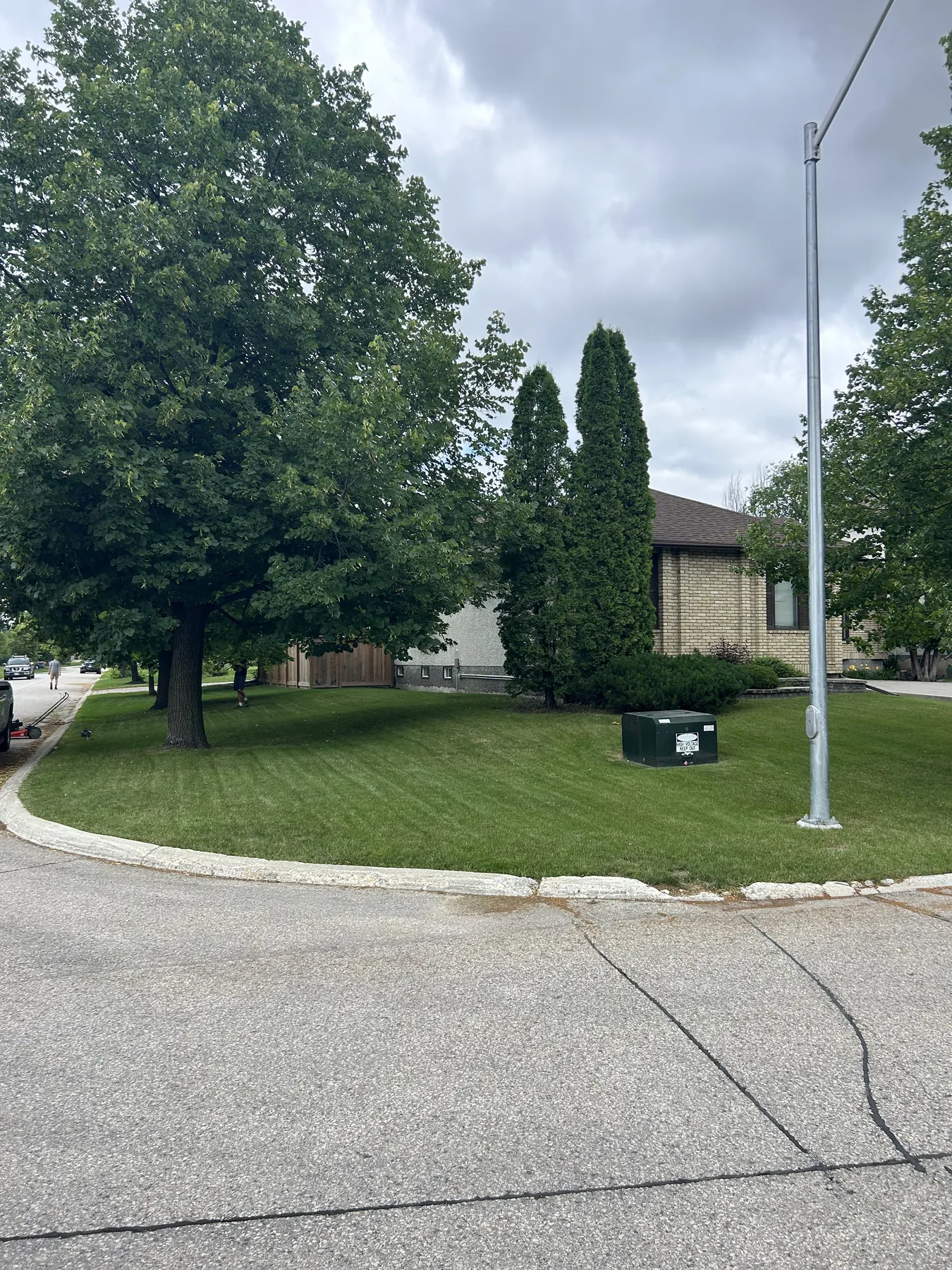 Maintained green lawn on a Winnipeg corner lot
