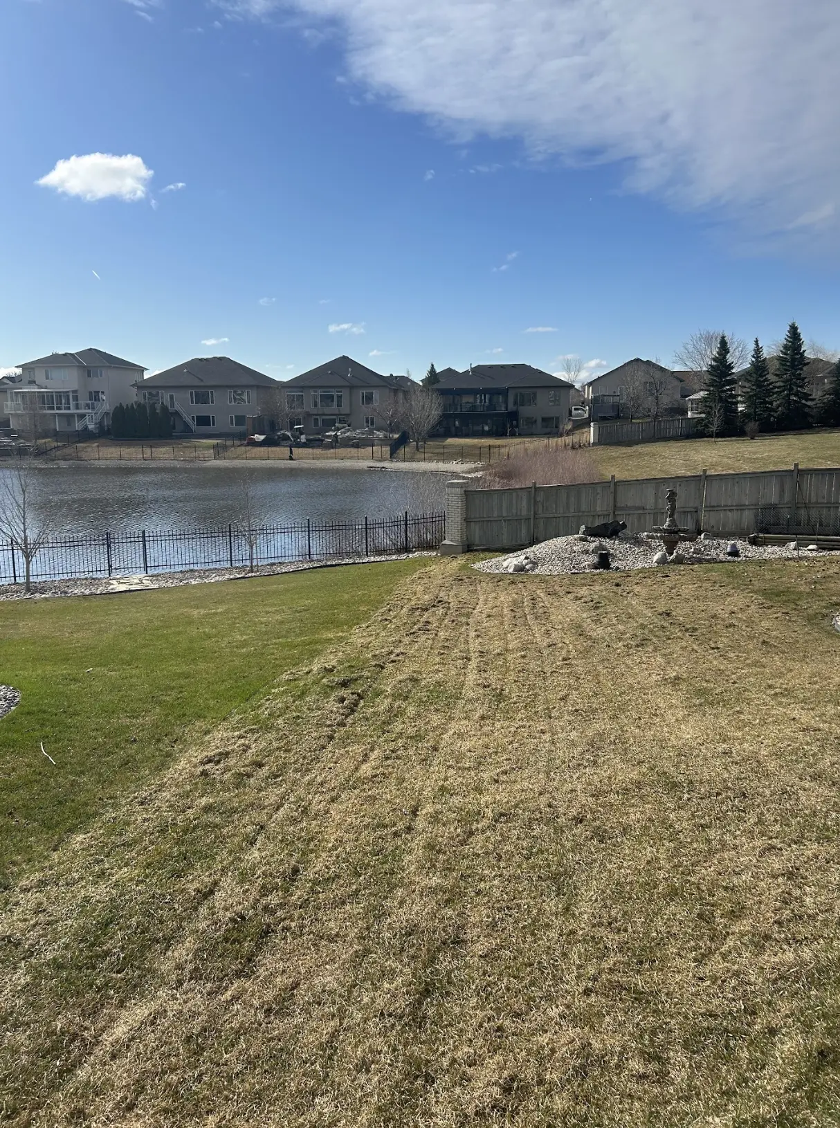 Visible results after spring power raking on a Winnipeg lawn
