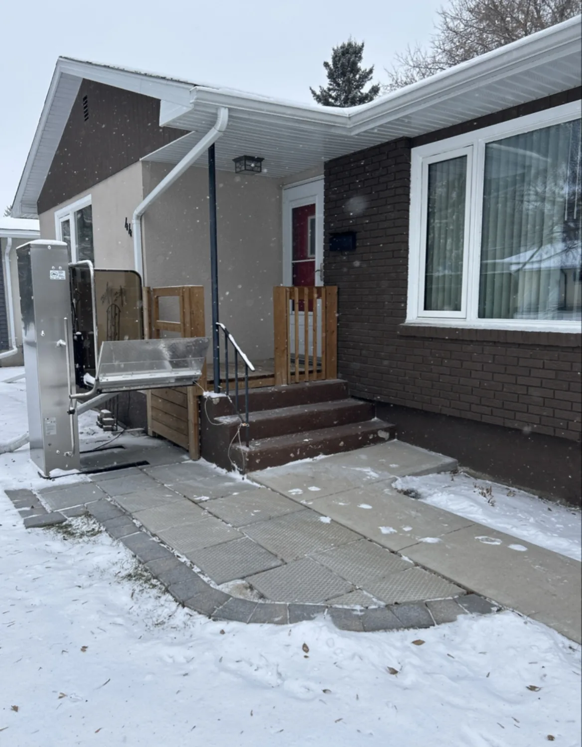 Front walkway and house steps cleared after snowfall